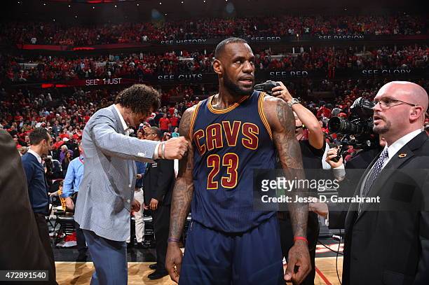 LeBron James of the Cleveland Cavaliers celebrates with his teammates after hitting the game winning shot with .7 seconds left in the game against...