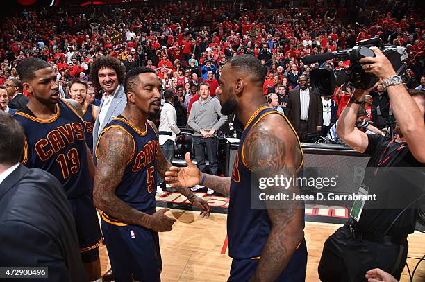 LeBron James of the Cleveland Cavaliers celebrates with J.R. Smith after hitting the game winning shot with .7 seconds left in the game against the...