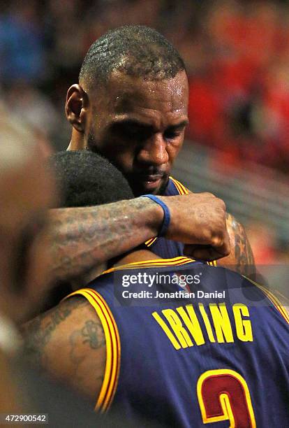 LeBron James of the Cleveland Cavaliers hugs Kyrie Irving after a win against the Chicago Bulls in Game Four of the Eastern Conference Semifinals of...