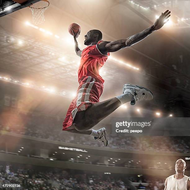 mid-air-basketball-slam dunk jump - point scoring stock-fotos und bilder