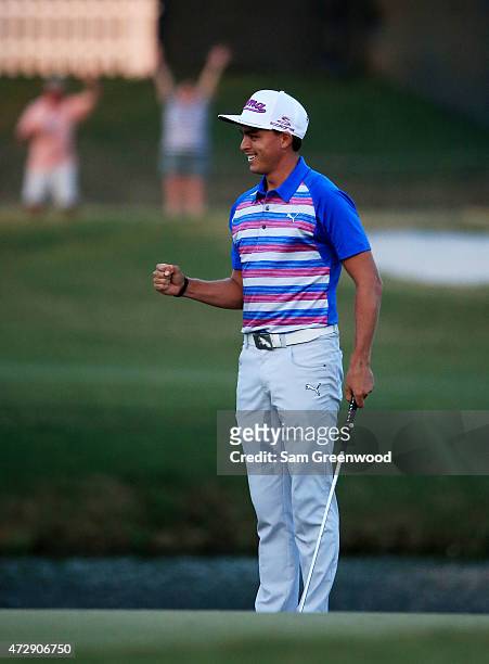 Rickie Fowler celebrates as he wins the playoff in the final round of THE PLAYERS Championship at the TPC Sawgrass Stadium course on May 10, 2015 in...