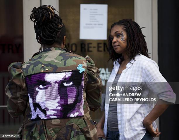 Prince fans wait to enter a "Rally 4 Peace" concert in Baltimore, Maryland on May 10, 2015. Musical artist Prince is holding the concert in Baltimore...