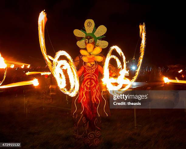 fire dancers at the beltane fire festival, edinburgh - beltane stockfoto's en -beelden