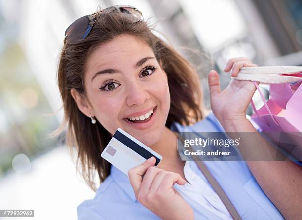 shopping woman with a credit card - loyalty card stock pictures, royalty-free photos & images
