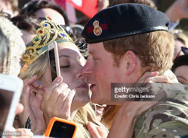 Prince Harry gets kissed by Royal Fan Victoria McRae during a walkabout outside the Sydney Opera House on May 7, 2015 in Sydney, Australia. Prince...