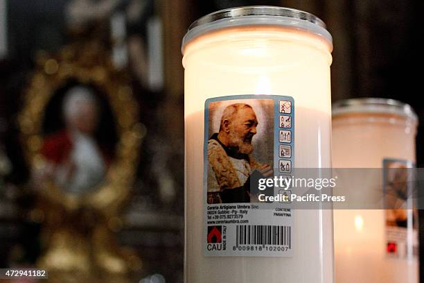 Candle with the image of St. Padre Pio.