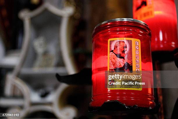 Candle with the image of St. Padre Pio.