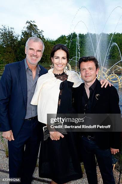 Adriana Abascal standing between her husband Emmanuel Schreder and Contemporary Artist and Sculptor of fountains of the "Bosquet du Theatre d'eau",...