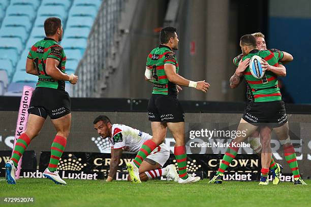 Aaron Gray Rabbitohs celebrates with his team mates after scoring a try during the round nine NRL match between the South Sydney Rabbitohs and the St...