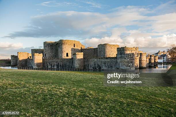 castle and moat, - beaumaris stock pictures, royalty-free photos & images