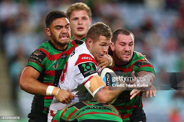 Trent Merrin of the Dragons is tackled during the round nine NRL match between the South Sydney Rabbitohs and the St George Illawarra Dragons at ANZ...