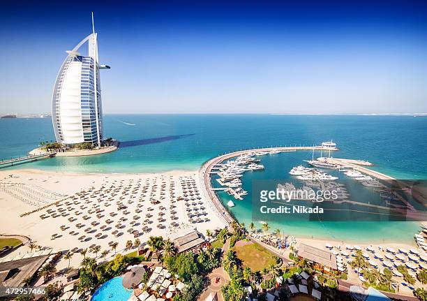 burj al arab hotel and a marina, dubai - panorama dubai stockfoto's en -beelden