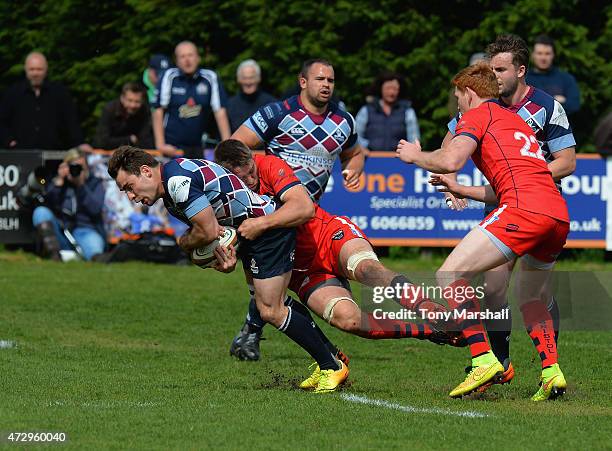 Sean Scanlon of Rotherham Titans is tackled by Ryan Jones of Bristol during the Greene King IPA Championship Playoff Semi-Final match between...