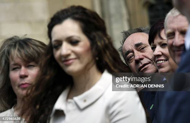 Former Scotland first minister and newly-elected member of parliament , Alex Salmond looks through the crowd of newly-elected Scottish National Party...