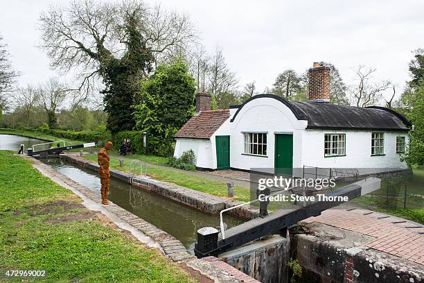 General view of the newly installed sculpture by artist Anthony Gormley at the Canal Workers Cottage on May 11, 2015 in Henley-In-Arden,...