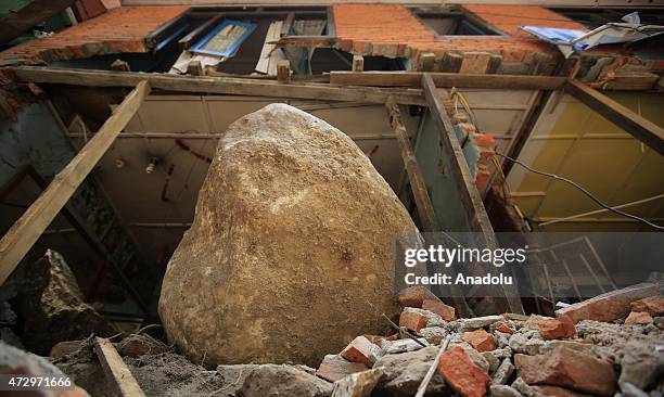Debris of a building destroyed a huge rock in Nepal's Kodari near the Tibet Autonomous Region of China on May 10 after Nepal eartquake-induced...