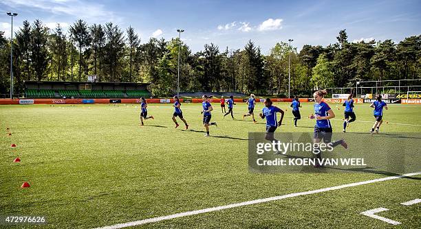 Players of the Dutch women football team take part in a training session in Harderwijk on May 11 in preparation of the coming women's Football World...