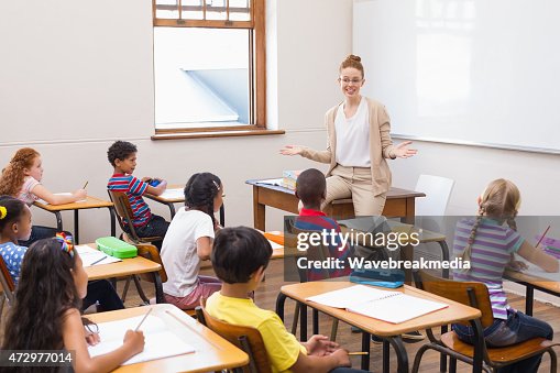 Lesson For Teched Teacher Giving A Lesson In Classroom High-Res Stock Photo - Getty Images