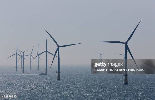 Aerial view taken on May 11, 2015 shows windmills of the "Nordsee Ost" wind park off the coast of the North Sea island of Helgoland, northern...