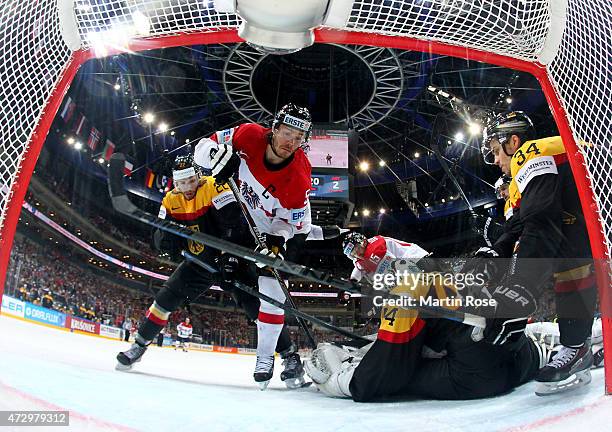 Thomas Raffl of Austria fails to score over Dennis Endras,goaltender of Germany during the IIHF World Championship group A match between Germany and...