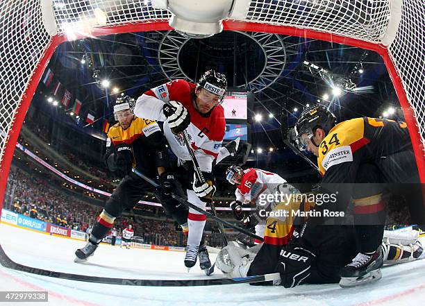 Thomas Raffl of Austria fails to score over Dennis Endras,goaltender of Germany during the IIHF World Championship group A match between Germany and...