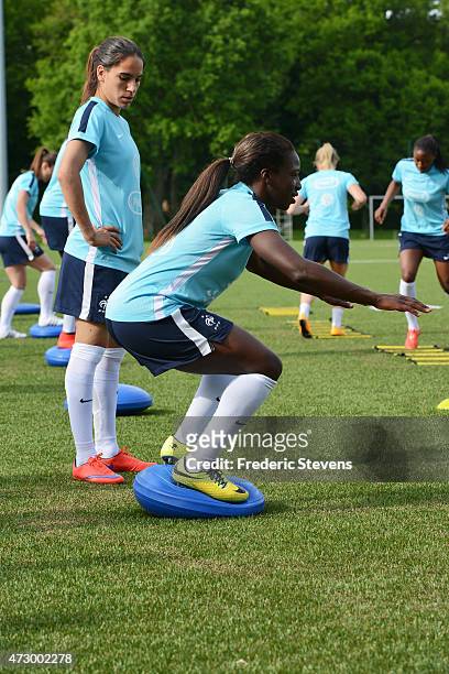 France's defender Amel Majri and Viviane Asseyi during a football training session in Clairefontaine-en-Yvelines on May 11, 2015 in Clairefontaine,...