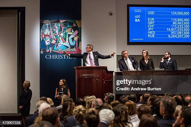 Jussi Pylkkanen, president of Christie's, takes bids at an auction for the art work, "Les femmes d'Alger " painted by Pablo Picasso, at Christie's on...