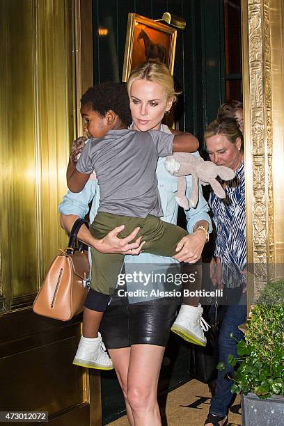 Charlize Theron and her son Jackson Theron are seen having dinner at The Polo Bar on May 11, 2015 in New York City.