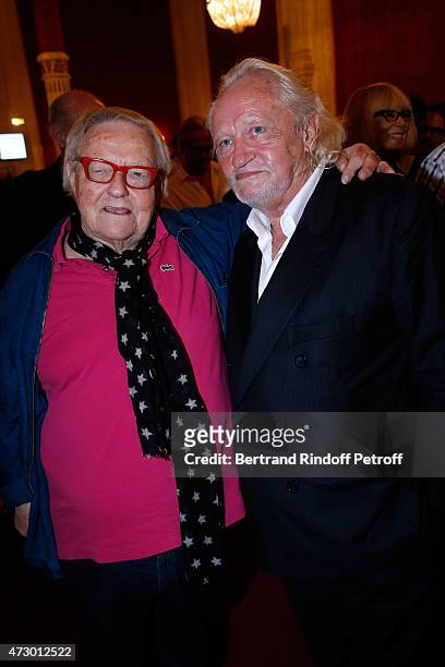 Actors Roger Dumas and Niels Arestrup pose after the 'Open Space' : Theater Play at Theatre de Paris on May 11, 2015 in Paris, France.
