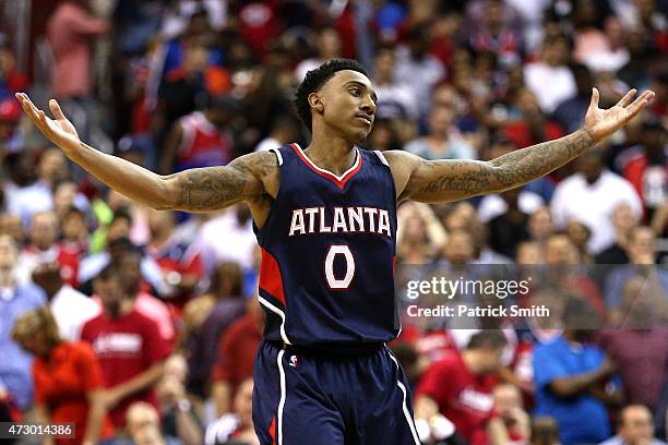 Jeff Teague of the Atlanta Hawks celebrates after hitting a shot against the Washington Wizards during the second half in Game Four of the Eastern...