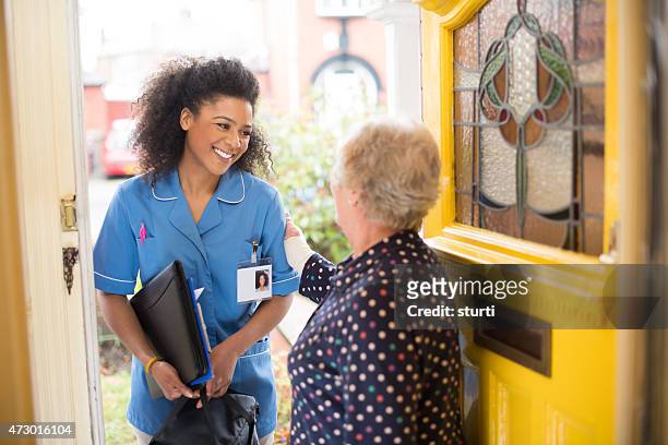 community carer  visit to senior - nurse leaving stock pictures, royalty-free photos & images