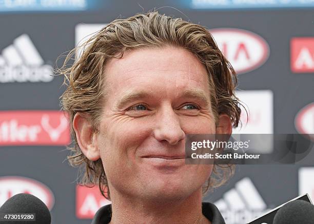 James Hird, coach of the Bombers smiles as he speaks to the media during an Essendon Bombers AFL recovery session at St Kilda Sea Baths on May 12,...