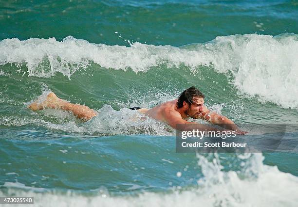 Jobe Watson, captain of the Bombers swims in the water during an Essendon Bombers AFL recovery session at St Kilda Sea Baths on May 12, 2015 in...