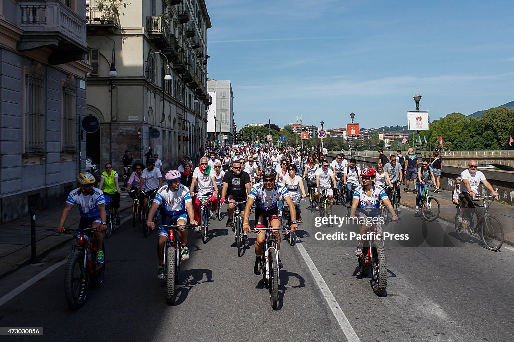 People join the cycle parade on the occasion of the 70th...