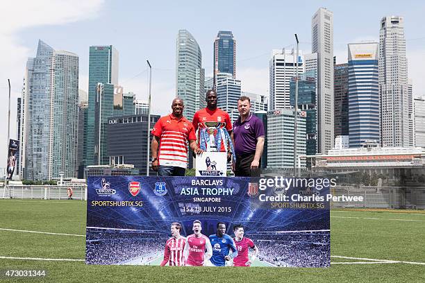 Ian Wright , former Arsenal player, Mamady Sidibe , former Stoke player, and Graham Stuart, former Everton player, pose with the Barclays Asia Trophy...