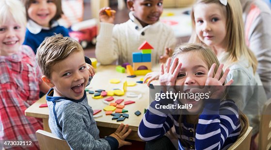 Playful preschoolers having fun making faces Playful preschoolers having fun making faces