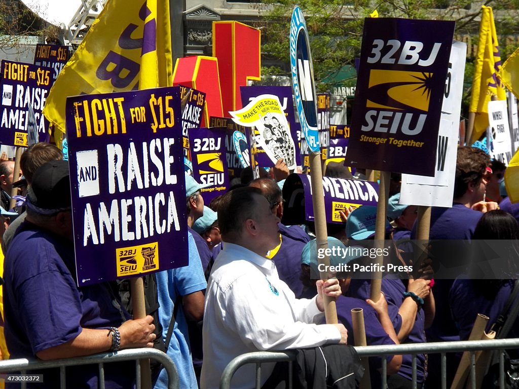 Protesters holding placards during the "15Now" strike.