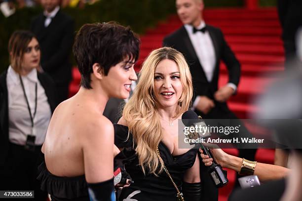 Singers Katy Perry and Madonna attend the "China: Through The Looking Glass" Costume Institute Benefit Gala at the Metropolitan Museum of Art on May...