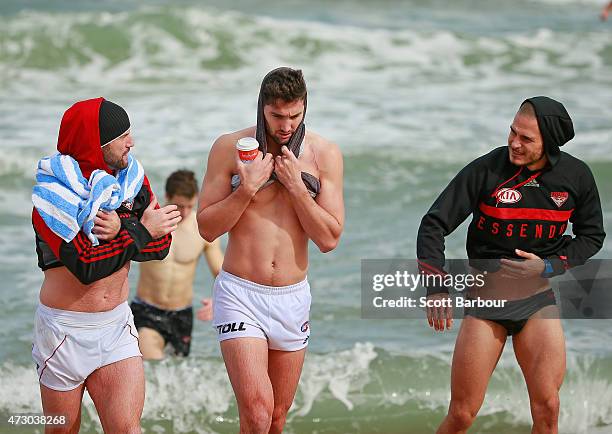 Paul Chapman and David Zaharakis of the Bombers leave the water during an Essendon Bombers AFL recovery session at St Kilda Sea Baths on May 12, 2015...