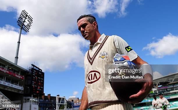 Kevin Pietersen of Surrey leaves the field at the end of the Surrey innings on 355 not out during day three of the LV County Championship match...