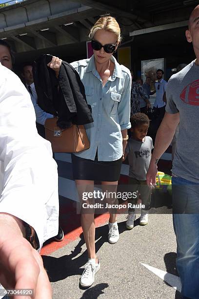 Charlize Theron and her son Jackson Theron arrive at Nice Airport during the 68th annual Cannes Film Festival on May 12, 2015 in Cannes, France.