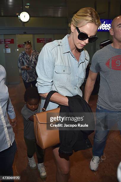 Charlize Theron and her son Jackson Theron arrive at Nice Airport during the 68th annual Cannes Film Festival on May 12, 2015 in Cannes, France.