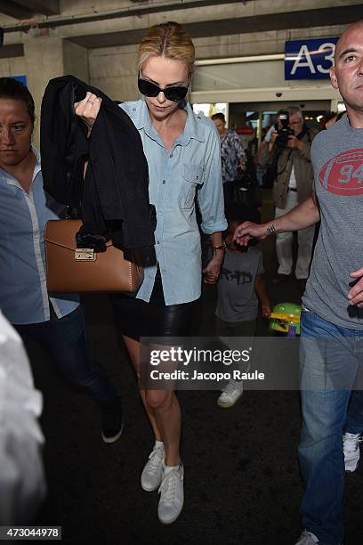 Charlize Theron and her son Jackson Theron arrive at Nice Airport during the 68th annual Cannes Film Festival on May 12, 2015 in Cannes, France.