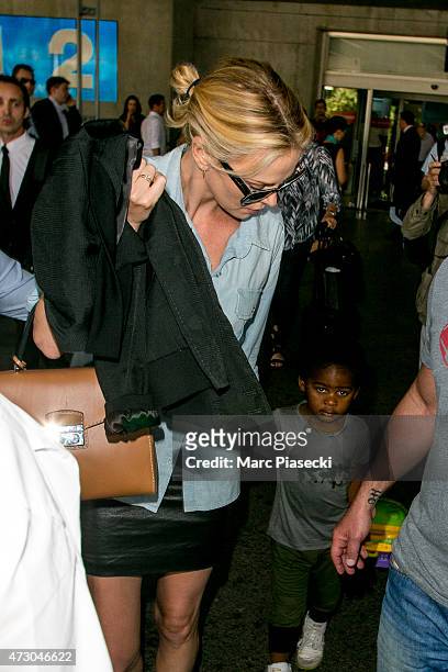 Actress Charlize Theron and her son Jackson arrive at the Nice airport ahead the 68th annual Cannes Film Festival on May 12, 2015 in Cannes, France.