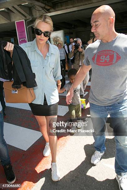 Actress Charlize Theron and her son Jackson arrive at the Nice airport ahead the 68th annual Cannes Film Festival on May 12, 2015 in Cannes, France.