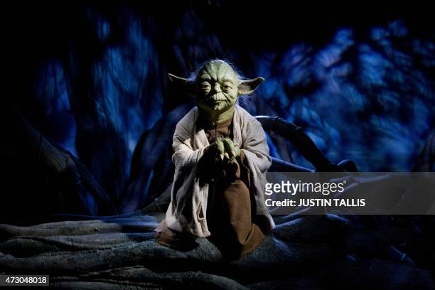 The wax figure of Star Wars character Yoda is pictured at the Star Wars At Madame Tussauds attraction in London on May 12, 2015. AFP PHOTO/JUSTIN...