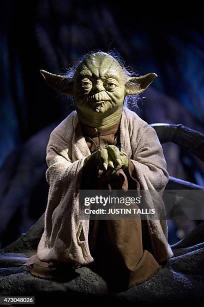 The wax figure of Star Wars character Yoda is pictured at the Star Wars At Madame Tussauds attraction in London on May 12, 2015. AFP PHOTO/JUSTIN...