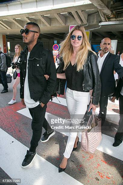 Model Doutzen Kroes and husband Sunnery James arrive at Nice airport ahead the 68th annual Cannes Film Festival on May 12, 2015 in Cannes, France.