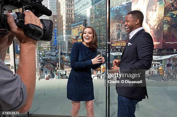 Calloway interviews Megan Boone during her visit to "Extra" at their New York studios at H&M in Times Square on May 12, 2015 in New York City.