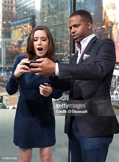 Calloway interviews Megan Boone during her visit to "Extra" at their New York studios at H&M in Times Square on May 12, 2015 in New York City.